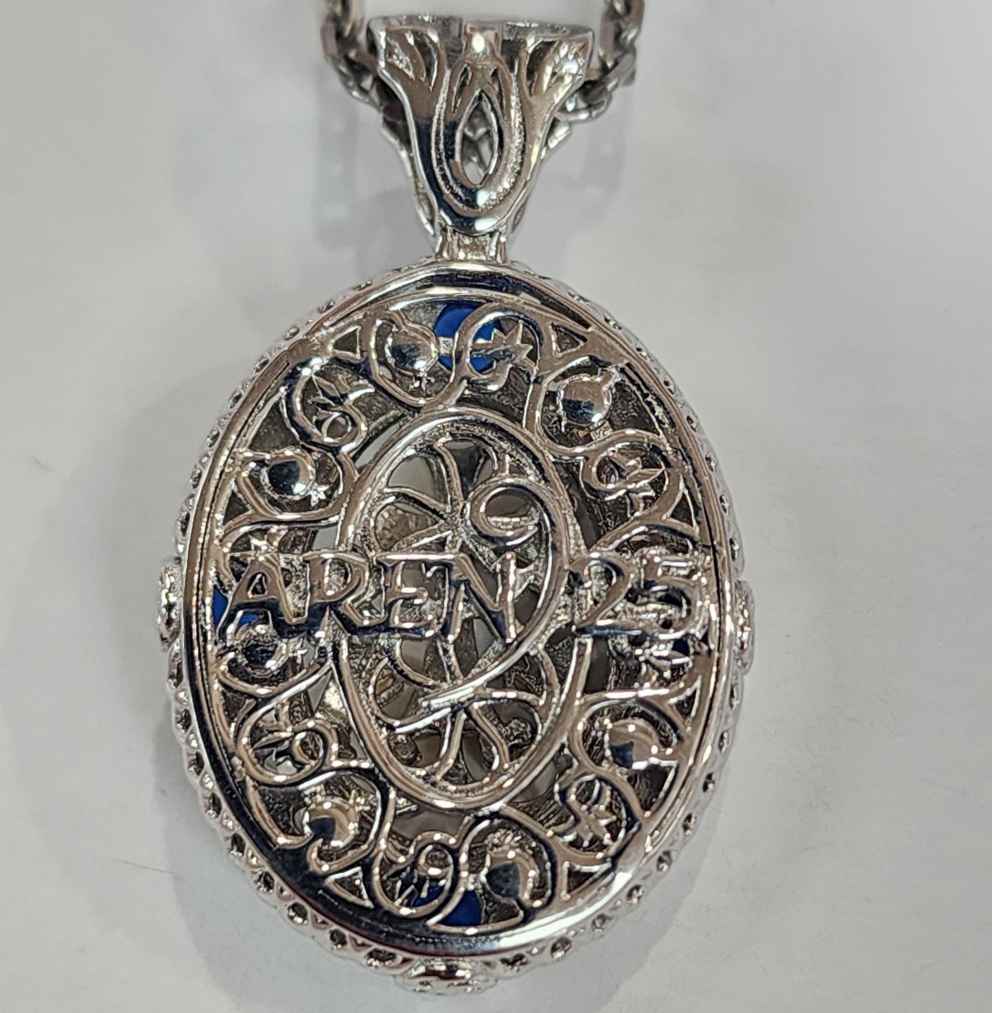 "Talar" Oval blue stone cross pendant